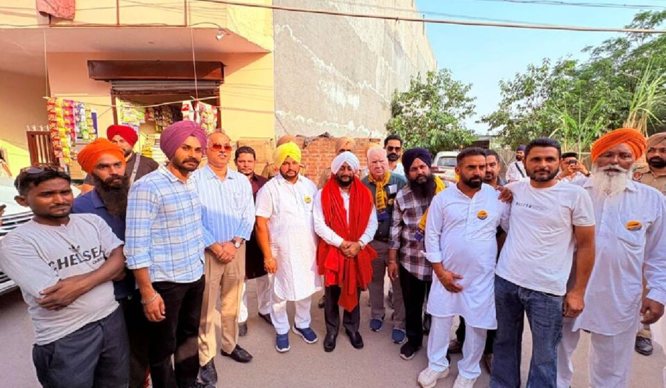 MLA Kulwant Singh interacting with residents during the Aap Di Sarkar Aap Da MC campaign in support of Harjit Singh in Ward 22, Mohali.