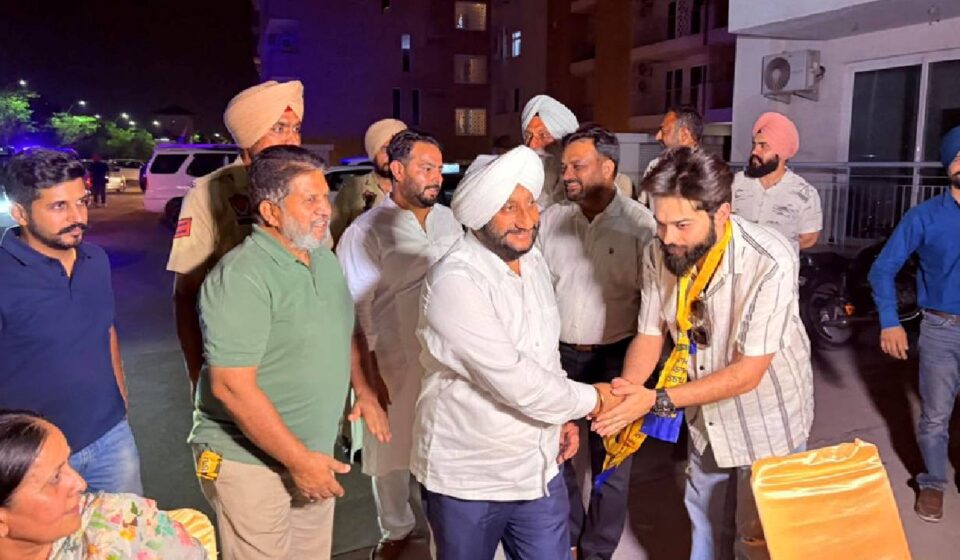 MLA Kulwant Singh interacting with residents during an election campaign in support of Kritika Sharma at Wave Estate in Ward 41, Mohali.