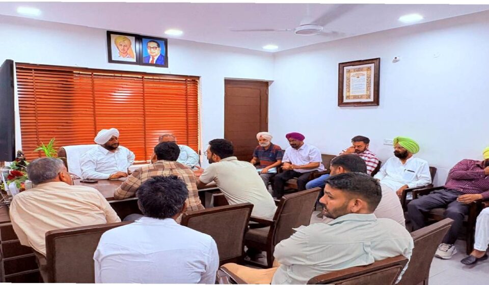 MLA Kulwant Singh interacting with residents during a public grievance meeting in Mohali focused on citizen services and local development issues