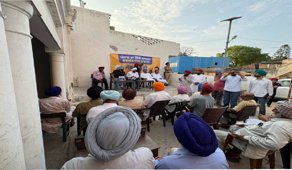 MLA Kulwant Singh interacting with residents during a community meeting in Manak Majra village, SAS Nagar Mohali, discussing development works and public welfare initiatives.