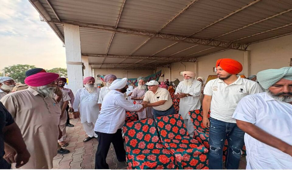 MLA Kulwant Singh interacting with residents during a community meeting in Bahrampur village, SAS Nagar Mohali, discussing development works and public welfare initiatives.