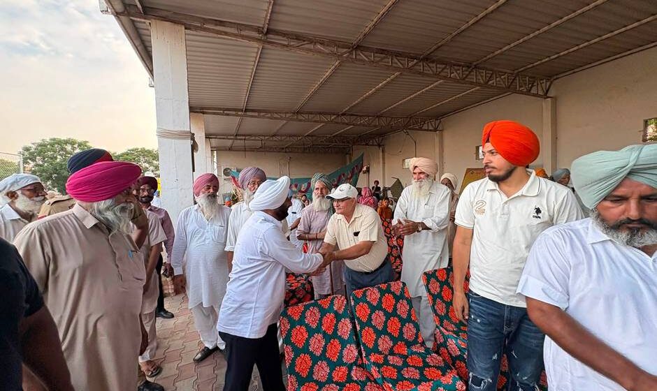 MLA Kulwant Singh interacting with residents during a community meeting in Bahrampur village, SAS Nagar Mohali, discussing development works and public welfare initiatives