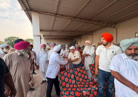 MLA Kulwant Singh interacting with residents during a community meeting in Bahrampur village, SAS Nagar Mohali, discussing development works and public welfare initiatives