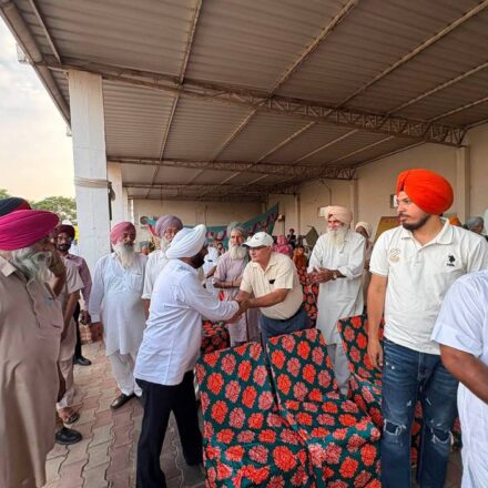 MLA Kulwant Singh interacting with residents during a community meeting in Bahrampur village, SAS Nagar Mohali, discussing development works and public welfare initiatives