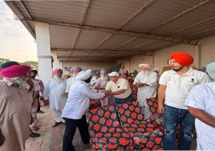 MLA Kulwant Singh interacting with residents during a community meeting in Bahrampur village, SAS Nagar Mohali, discussing development works and public welfare initiatives