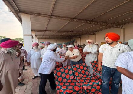 MLA Kulwant Singh interacting with residents during a community meeting in Bahrampur village, SAS Nagar Mohali, discussing development works and public welfare initiatives