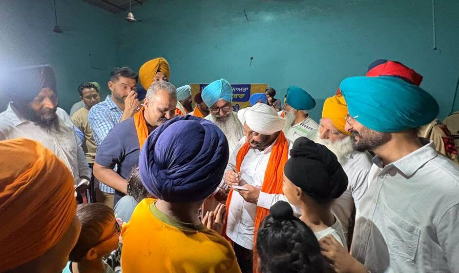 MLA Kulwant Singh interacting with residents of Bhagomajra village, SAS Nagar Mohali, during a community meeting on local development and public welfare.