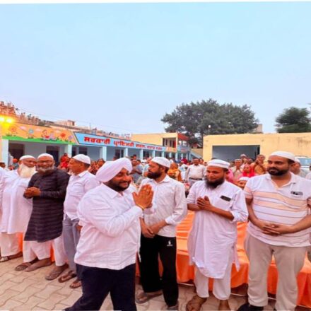 MLA Kulwant Singh interacting with residents during a community meeting in Jujhar Nagar, SAS Nagar Mohali, highlighting development initiatives and screening a documentary on Sri Guru Ravidas Ji.