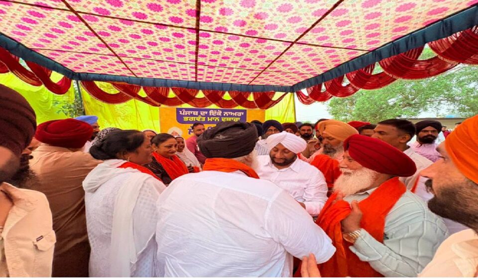MLA Kulwant Singh interacting with residents during a Lok Milni programme in Barmajra village, SAS Nagar Mohali, and screening a documentary on Sri Guru Ravidas Ji.