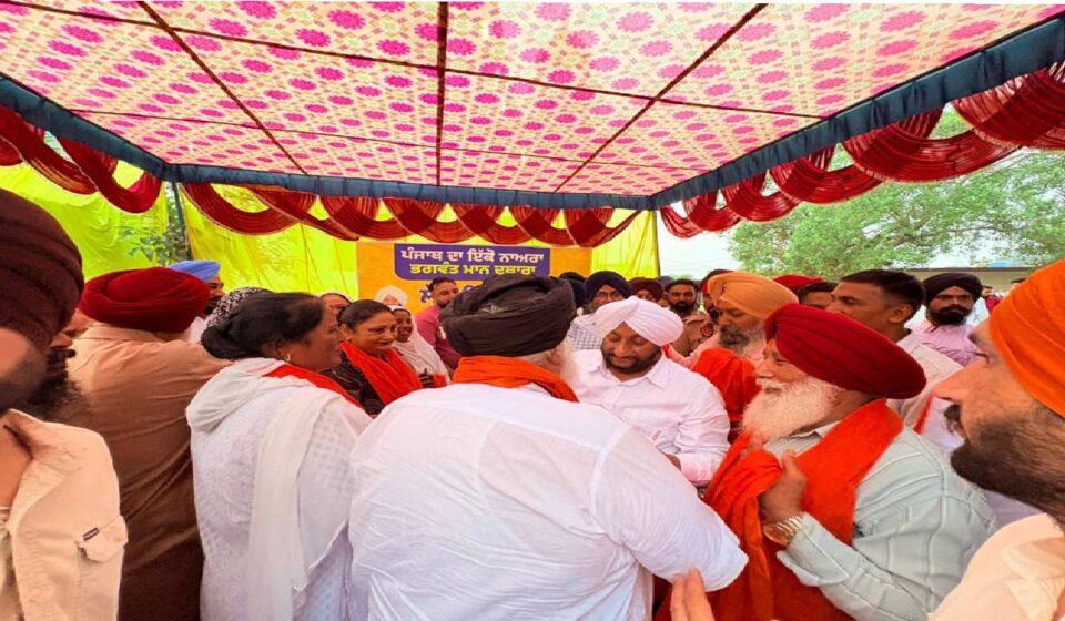 MLA Kulwant Singh interacting with residents during a Lok Milni programme in Barmajra village, SAS Nagar Mohali, and screening a documentary on Sri Guru Ravidas Ji.