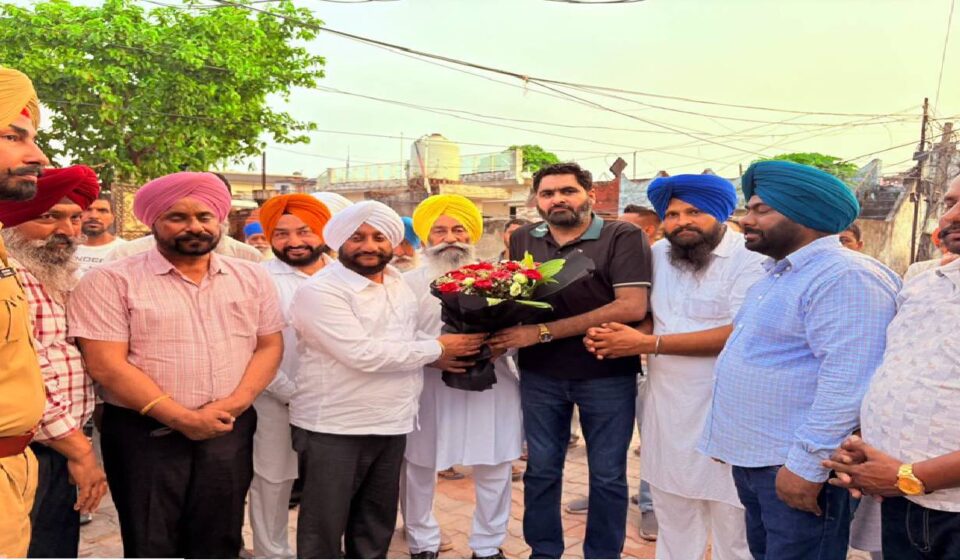 MLA Kulwant Singh interacting with residents during a Lok Milni programme in Raipur village, SAS Nagar Mohali, discussing development projects and public welfare initiatives