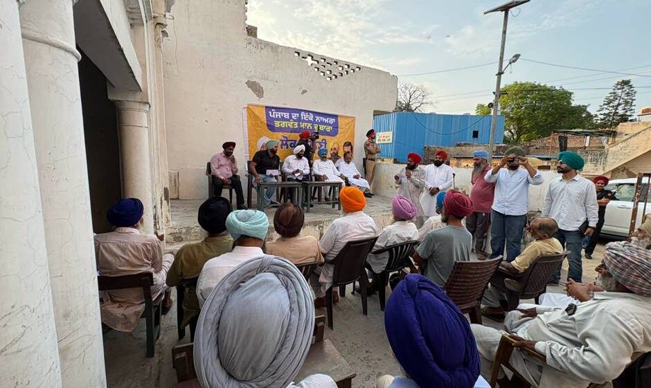 MLA Kulwant Singh interacting with residents during a community meeting in Manak Majra village, SAS Nagar Mohali, discussing development works and public welfare initiatives.