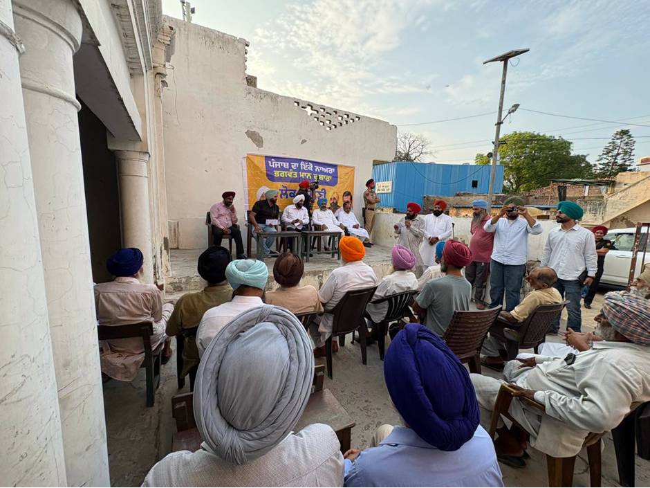 MLA Kulwant Singh interacting with residents during a community meeting in Manak Majra village, SAS Nagar Mohali, discussing development works and public welfare initiatives