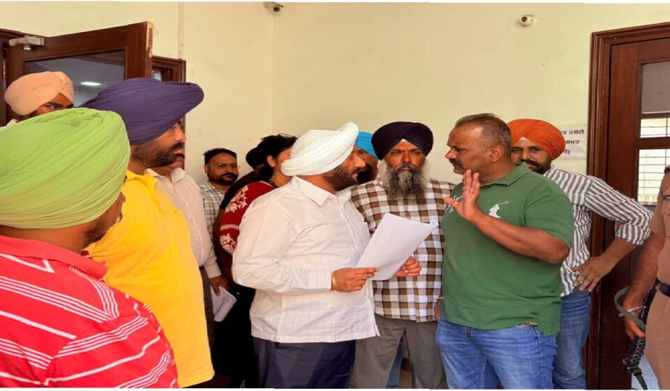 MLA Kulwant Singh interacting with residents during a public grievance meeting in SAS Nagar Mohali, listening to local issues and assuring timely action