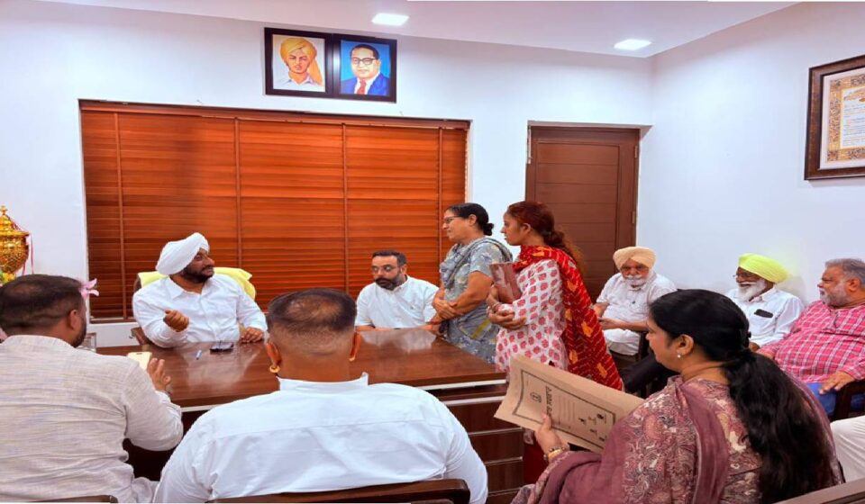 MLA Kulwant Singh interacting with residents at his constituency office in SAS Nagar Mohali, listening to public grievances and discussing local issues