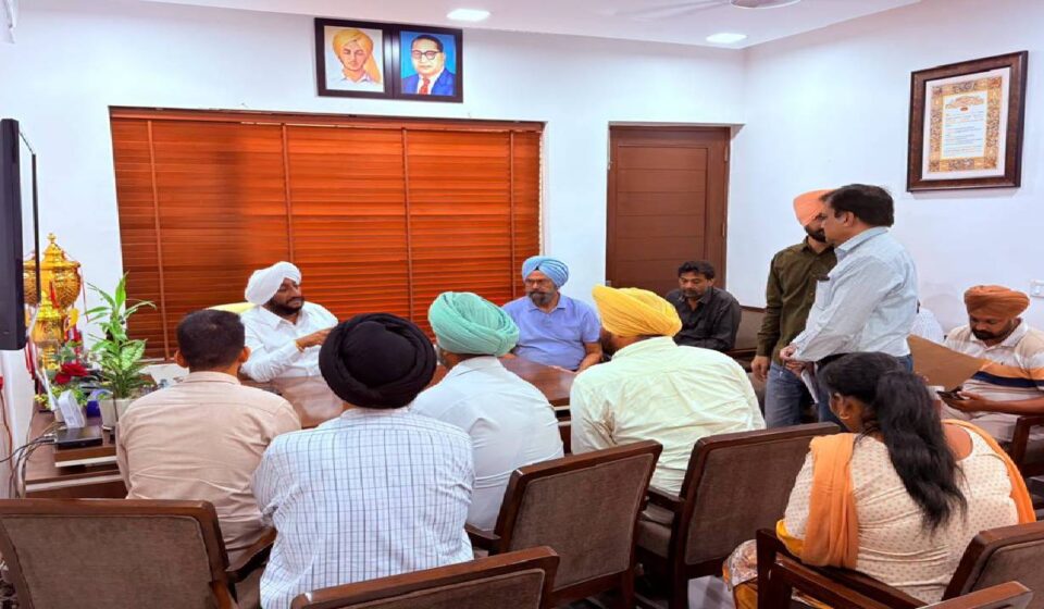 MLA Kulwant Singh interacting with residents at his constituency office in SAS Nagar Mohali, listening to public grievances and discussing local issues