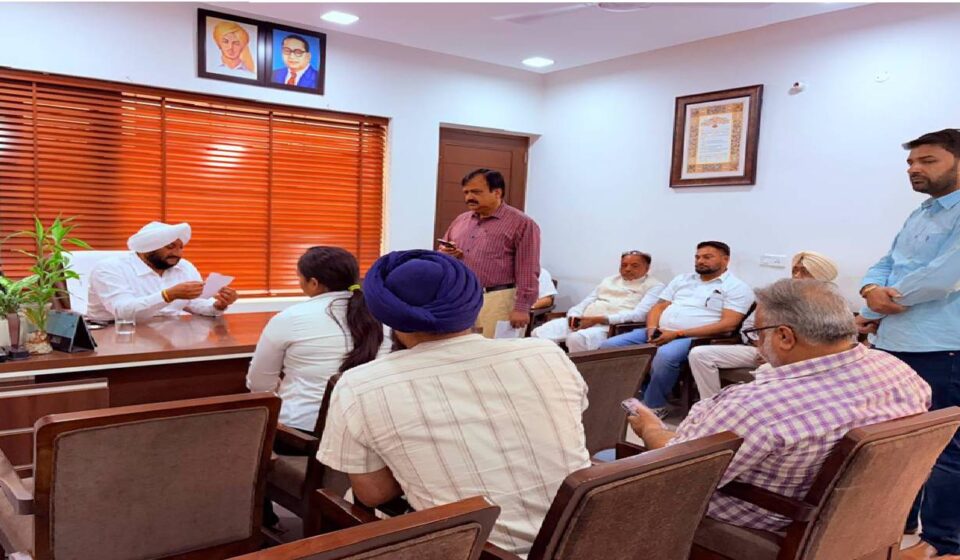 MLA Kulwant Singh interacting with residents during a public grievance meeting in SAS Nagar Mohali, listening to local concerns and assuring timely action