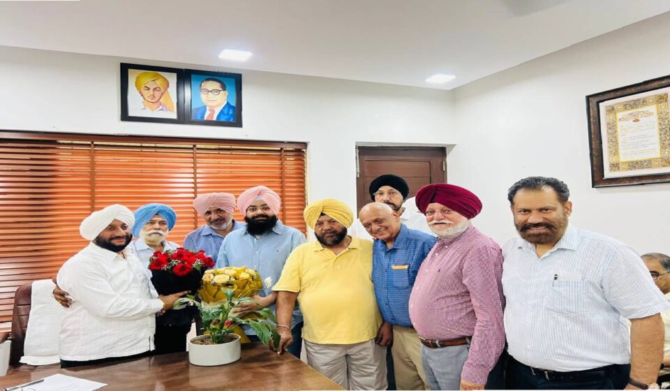MLA Kulwant Singh interacting with residents during a public grievance meeting in SAS Nagar Mohali, listening to local concerns and assuring timely action