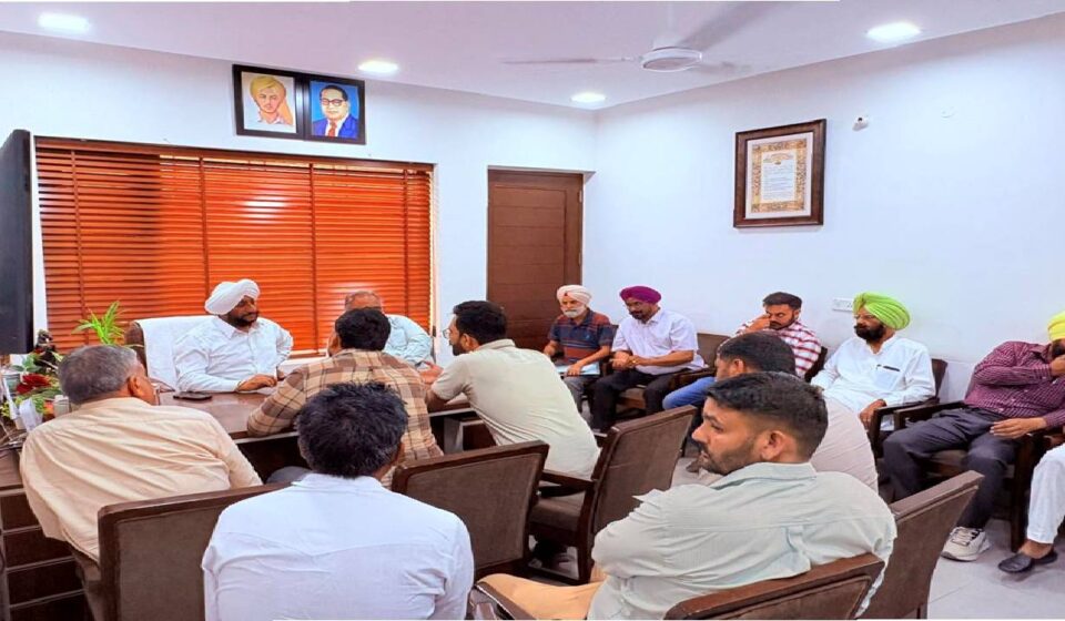 MLA Kulwant Singh interacting with residents during a public grievance meeting in Mohali focused on citizen services and local development issues.
