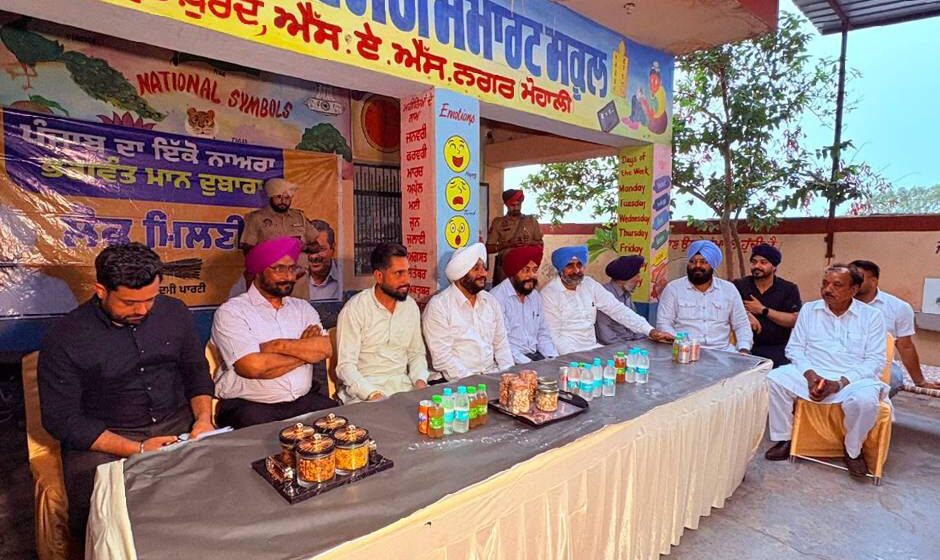 MLA Kulwant Singh interacting with residents during a public outreach programme in Raipur Khurd village, SAS Nagar Mohali, discussing development projects and public welfare initiatives.