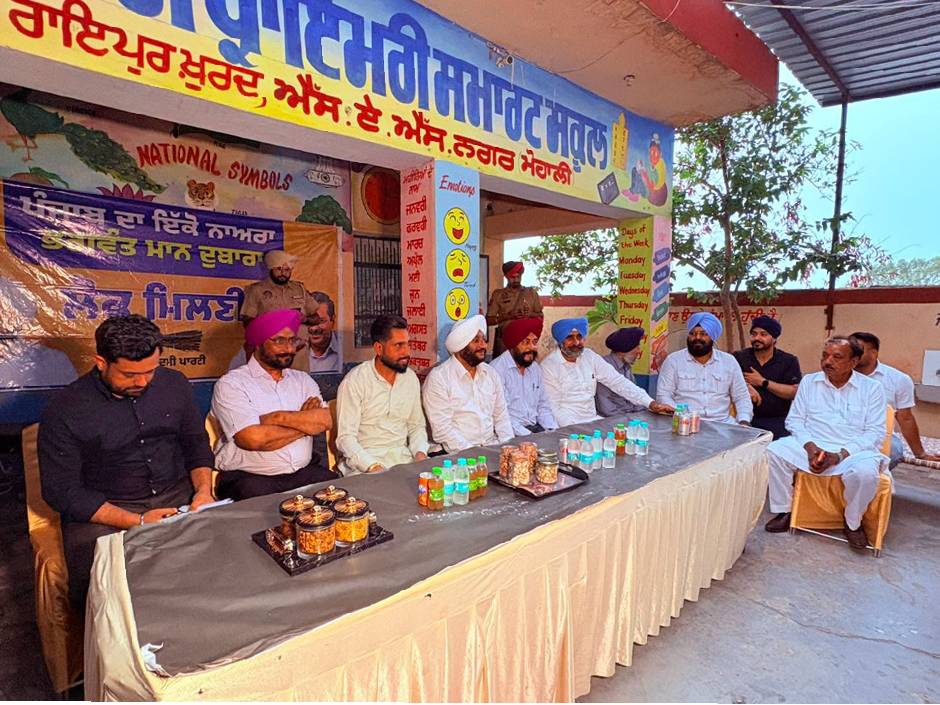 MLA Kulwant Singh interacting with residents during a public outreach programme in Raipur Khurd village, SAS Nagar Mohali, discussing development projects and public welfare initiatives.