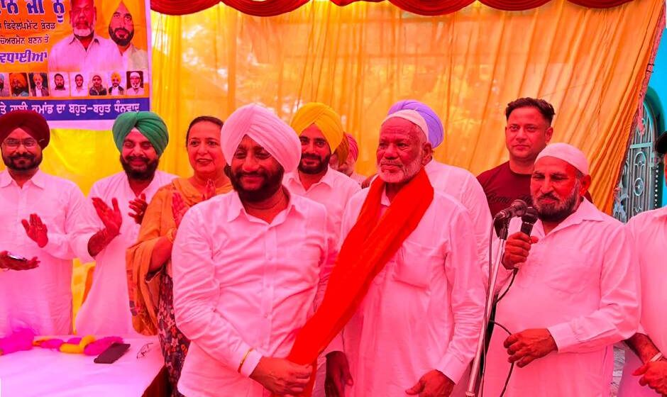 MLA Kulwant Singh congratulating Sodagar Khan during a thanksgiving ceremony following his appointment as Chairman of the Punjab State Muslim Development Board in Mohali.