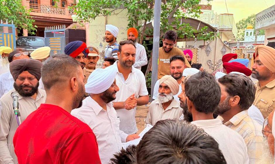 MLA Kulwant Singh interacting with residents during a community meeting in Sukhgarh village, SAS Nagar Mohali, discussing development projects and public welfare initiatives.