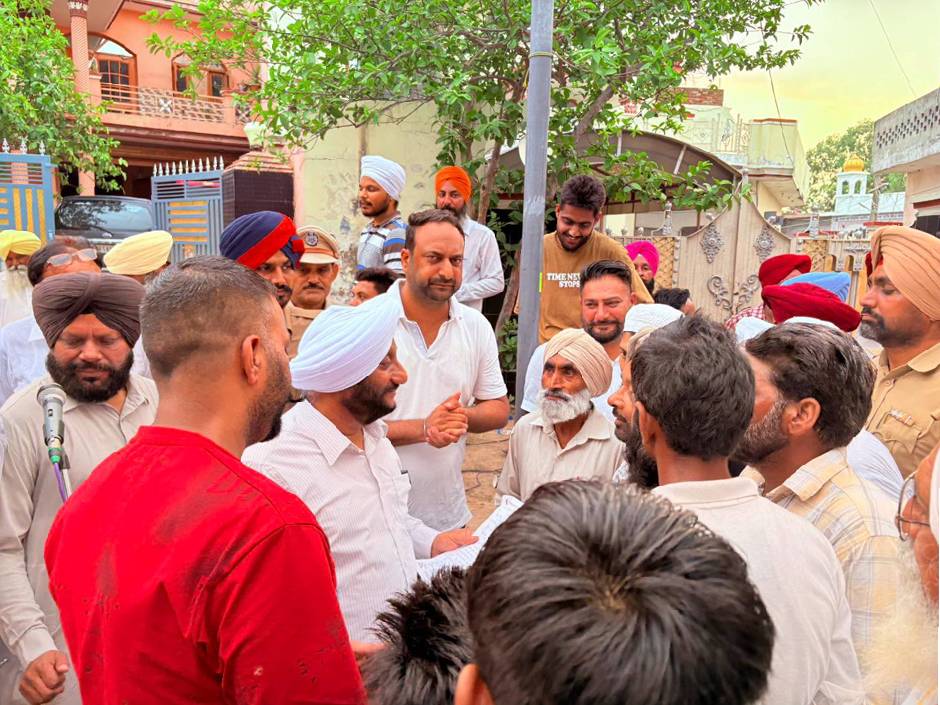 MLA Kulwant Singh interacting with residents during a community meeting in Sukhgarh village, SAS Nagar Mohali, discussing development projects and public welfare initiatives.