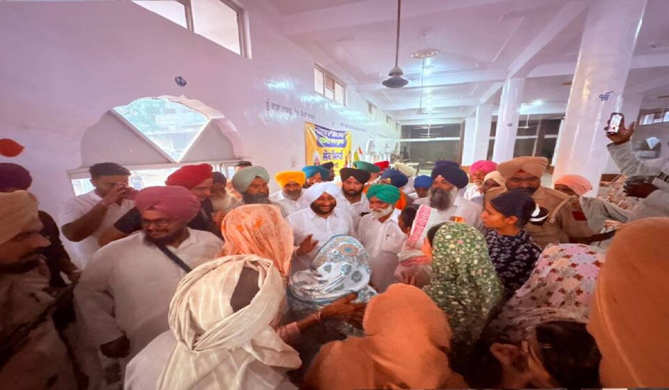 MLA Kulwant Singh interacting with residents during a public meeting in Tangori village, SAS Nagar Mohali, discussing development projects and public welfare initiatives