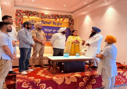 MLA Kulwant Singh distributing identity cards to War Against Drugs volunteers during a meeting in SAS Nagar Mohali to strengthen the anti-drug awareness campaign