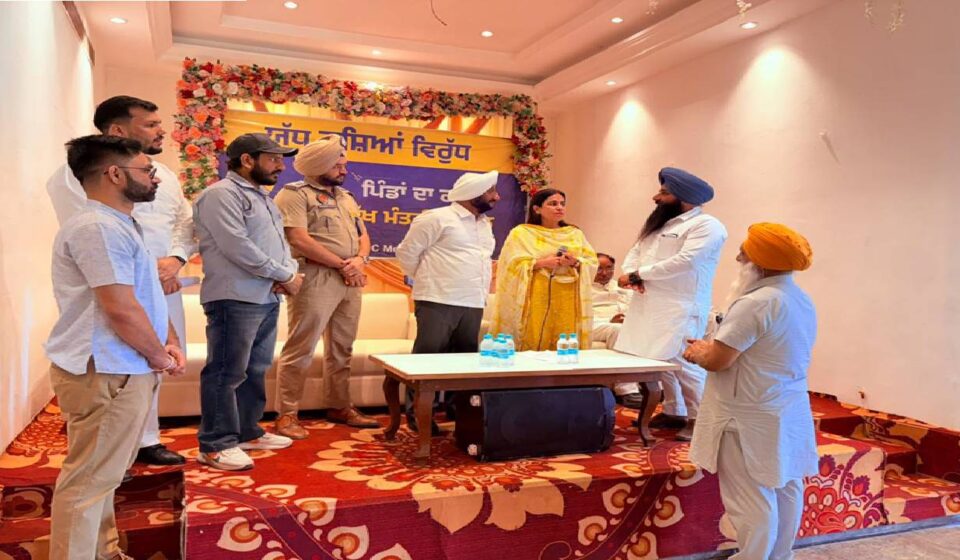 MLA Kulwant Singh distributing identity cards to War Against Drugs volunteers during a meeting in SAS Nagar Mohali to strengthen the anti-drug awareness campaign
