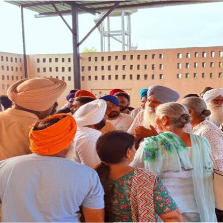 MLA Kulwant Singh interacting with residents during a Lok Milni meeting in Kalon village, SAS Nagar Mohali, discussing local issues and Punjab Government development initiatives