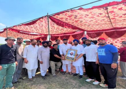 Mayor Sarabjeet Singh Samana interacts with young cricketers and organisers during a cricket tournament at Village Nagari in SAS Nagar Mohali.