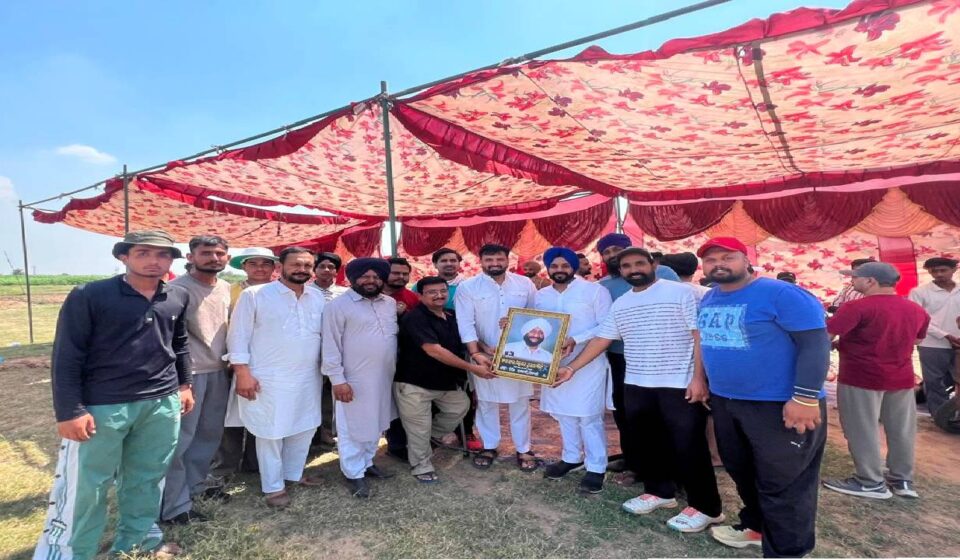 Mayor Sarabjeet Singh Samana interacts with young cricketers and organisers during a cricket tournament at Village Nagari in SAS Nagar Mohali.