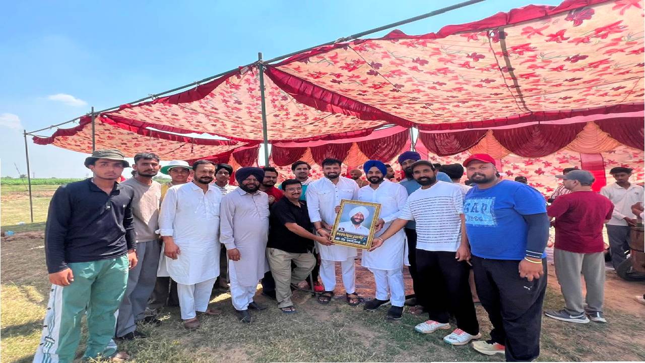 Mayor Sarabjeet Singh Samana interacts with young cricketers and organisers during a cricket tournament at Village Nagari in SAS Nagar Mohali.