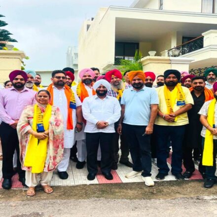 MLA Kulwant Singh welcomes Harjit Singh Bholu and supporters into the Aam Aadmi Party in Mohali.