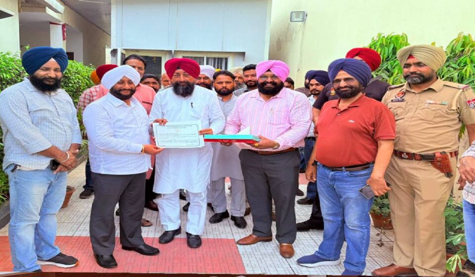 MLA Kulwant Singh congratulates Akwinder Singh Gosal for receiving Punjab Government certification for his services to culture and sports.
