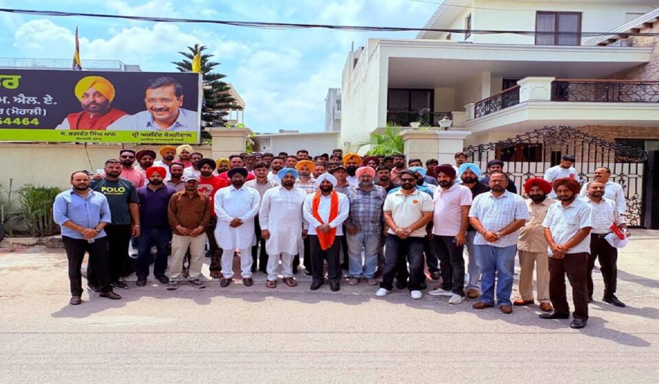 MLA Kulwant Singh interacting with residents during a public grievance meeting at his constituency office in Mohali.