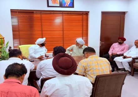 MLA Kulwant Singh interacting with residents during a public grievance meeting at his constituency office in Mohali.