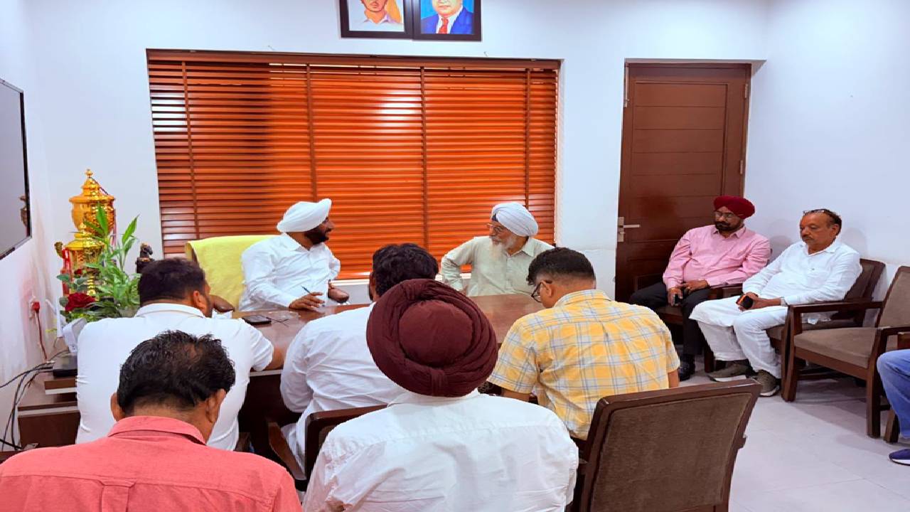 MLA Kulwant Singh interacting with residents during a public grievance meeting at his constituency office in Mohali.
