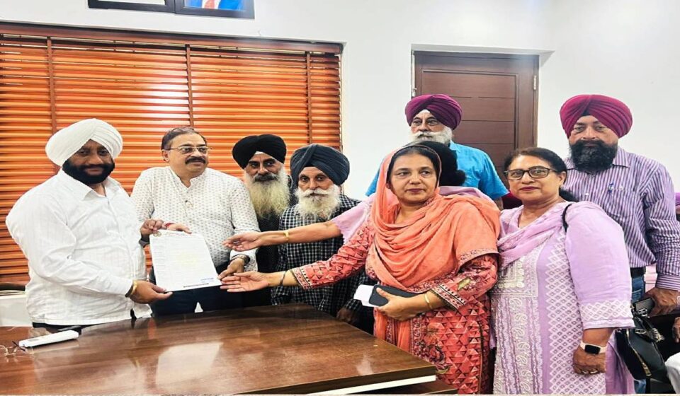 MLA Kulwant Singh interacting with residents during a public grievance meeting at his constituency office in Mohali