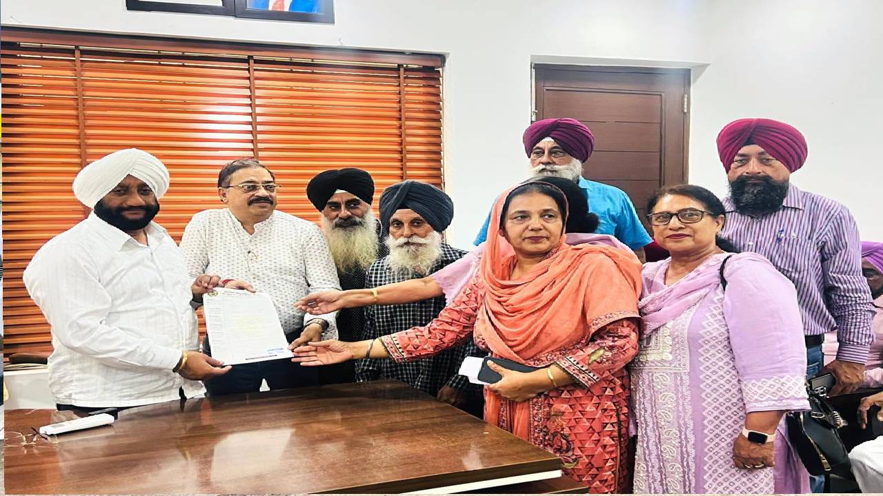 MLA Kulwant Singh interacting with residents during a public grievance meeting at his constituency office in Mohali