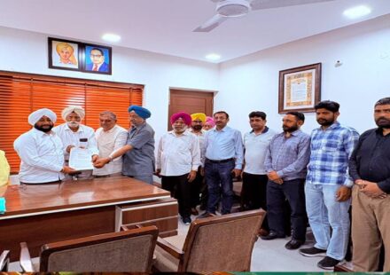 MLA Kulwant Singh interacting with residents during a public grievance meeting at his constituency office in Mohali.
