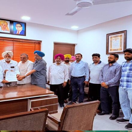 MLA Kulwant Singh interacting with residents during a public grievance meeting at his constituency office in Mohali.