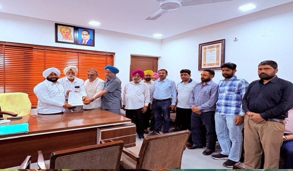 MLA Kulwant Singh interacting with residents during a public grievance meeting at his constituency office in Mohali.